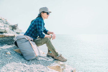 Wall Mural - Traveler girl resting on coast