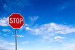 Stop Sign With Blue Sky Background and Copy Space