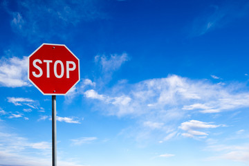 stop sign with blue sky background and copy space