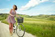 © ZoomTeam - beautiful vintage girl sitting next to bike, summer time