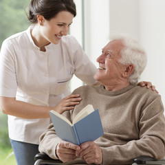 Wall Mural - Elderly man reading book