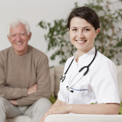 Wall Mural - Smiling doctor during home visit