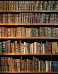 old books on wooden shelf.