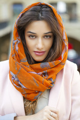 Wall Mural - Close up portrait of a muslim young woman wearing a head scarf