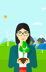 Poster - Woman holding plant.