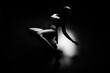 © lemonspeed - Sexy slim woman dancing in the dark on floor, wearing long white shirt and high heels