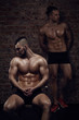 © honored - Two young muscular men