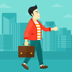 Wall Mural - Businessman walking with briefcase. 