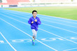 © TinPong - Boy runnin on blue track