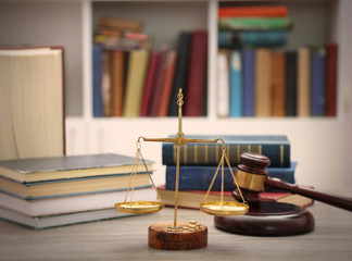 Wall Mural - Justice scales with gavel and stack of books on wooden table