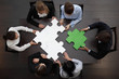 © alotofpeople - Business people assembling puzzle