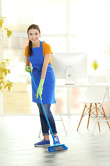 Wall Mural - Woman cleaning floor with mop indoors