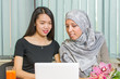 © creativefamily - Asian and muslim girls working on a laptop