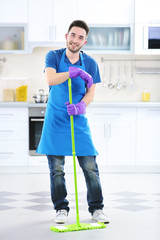 Wall Mural - Man with mop in the kitchen