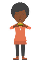 Canvas Print - Woman eating hamburger. 