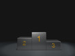 © jm1366 - metal podium winner on dark background
