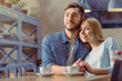 © zinkevych - Pleasant couple sitting at the table