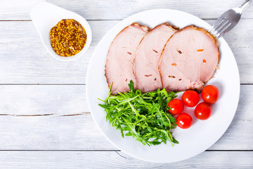 Poster - Sliced meat with arugula salad, cherry tomatoes, top view, close