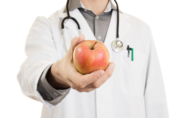 Wall Mural - Nutritionist doctor, giving an apple, isolated