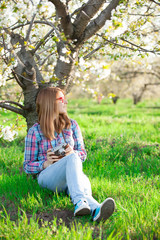 portrait of young woman  near the tree