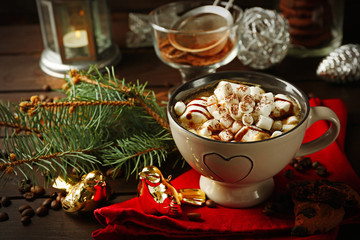 Poster - Mug of hot chocolate with marshmallows, fir tree branch on wooden background