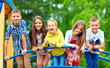 © Olesia Bilkei - happy excited kids having fun together on playground