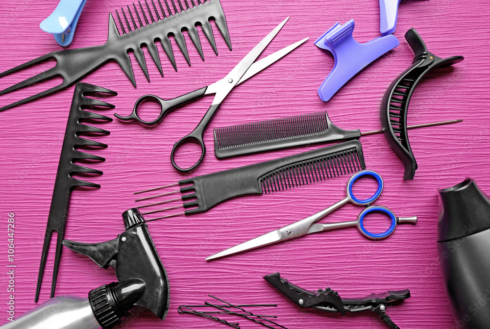 Hairdresser set with various accessories on violet background