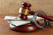 Law Gavel With Dollars And Handcuffs On Wooden Table Background, Closeup