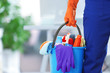 canvas print picture - holding cleaning products and tools on bucket, close up