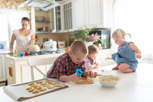 Children With Her Mother Preparing Cookies,  Large Family. Casua