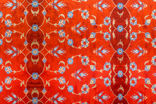 Abstract Orange Pattern With Leaves And Pale Blue Floral Features On Carpet