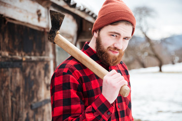 Poster - Smiling bearded man holding axe