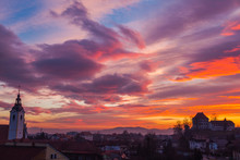 Kamnik, Slovenia - January 25, 2016. Tower Of The Immaculate Conception Church And Zaprice Castle, Built In 14th Century, On The Background Of Sunset Sky.