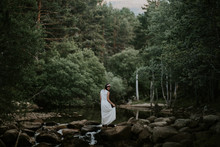 Brunette Woman In A White Dress In The Woods