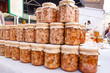 © myvarvara - Canned homemade meat in a glass jar on market