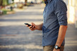 © opolja - Close up of man using mobile smart phone