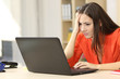 © Antonioguillem - Sad and worried entrepreneur with laptop
