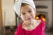 © Marc Romanelli/Blend Images - Caucasian girl smiling with towel wrapped on head