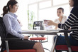 © Monet - The women have a discussion in the office