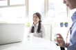 © Monet - Young business woman working in bright office