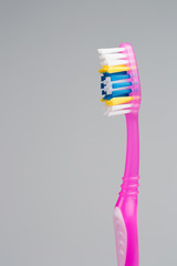 .toothbrush on grey background