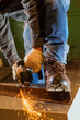 © idea_studio - Worker working of a grinding machine