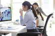 © Monet - Business woman is looking at the map of the world on PC