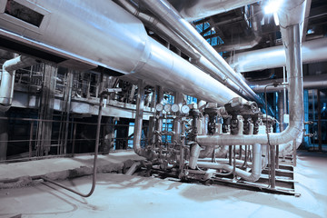 Equipment, cables and piping as found inside of a modern industr