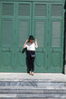 © sahachat - Girl in Old Green vintage door