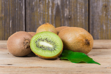 Wall Mural - fresh kiwi on wooden table