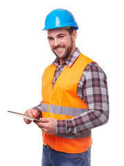 Manual worker in blue helmet using a digital tablet