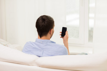 Sticker - close up of man with smartphone at home