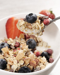 Wall Mural - diet weight loss breakfast, healthy food with muesli , strawberry and blueberry