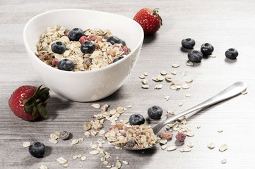 Wall Mural - diet weight loss breakfast, healthy food with muesli , strawberry and blueberry